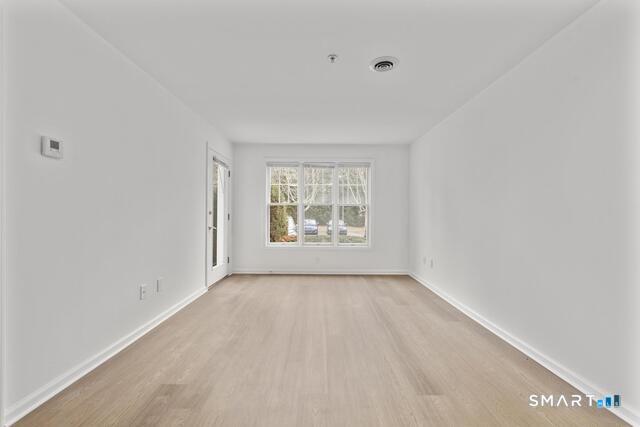 468 Main Street, Unit 111 East Lyme, CT 06357 - Photo 17 of 25 a view of an empty room with a window