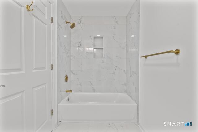 468 Main Street, Unit 111 East Lyme, CT 06357 - Photo 20 of 25 a bathroom with a bathtub