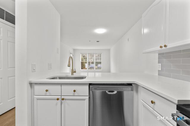 468 Main Street, Unit 111 East Lyme, CT 06357 - Photo 25 of 25 a kitchen with a sink and cabinets