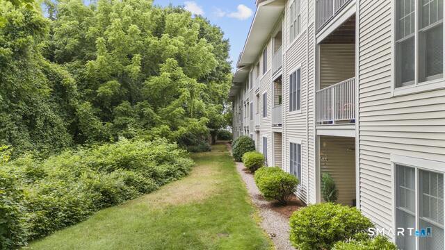 468 Main Street, Unit 111 East Lyme, CT 06357 - Photo 3 of 25 a view of a pathway with a house