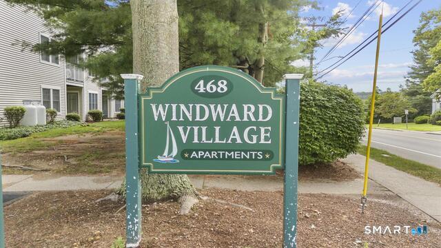 468 Main Street, Unit 111 East Lyme, CT 06357 - Photo 8 of 25 a sign that is on the side of a building