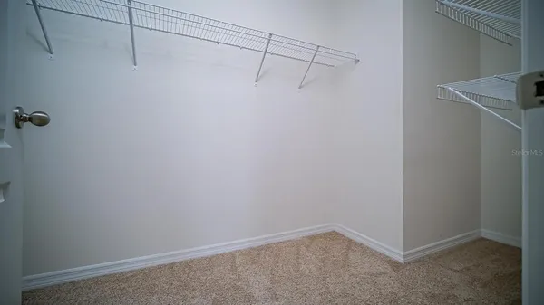 a view of a room with racks on the wall