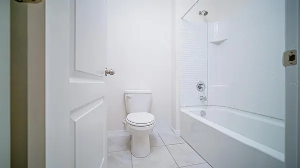 a bathroom with a bathtub toilet and sink