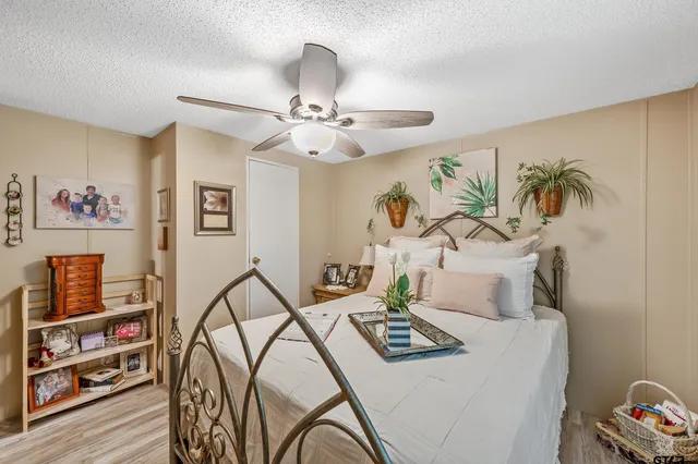a bedroom with furniture and a book shelf