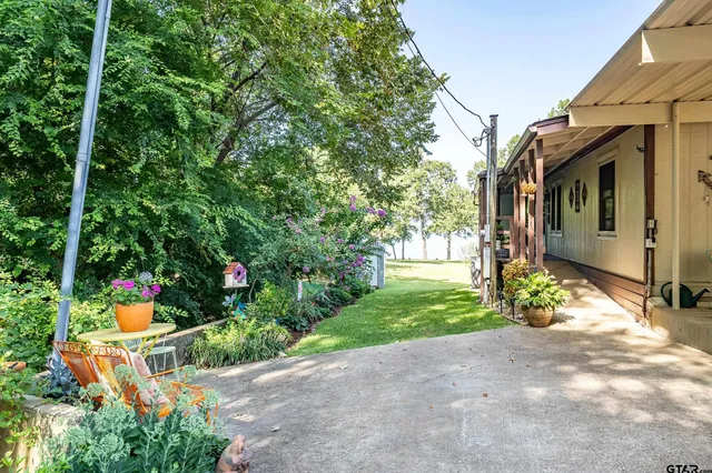 a view of a backyard with patio