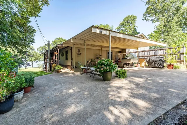 a view of a swimming pool with a patio