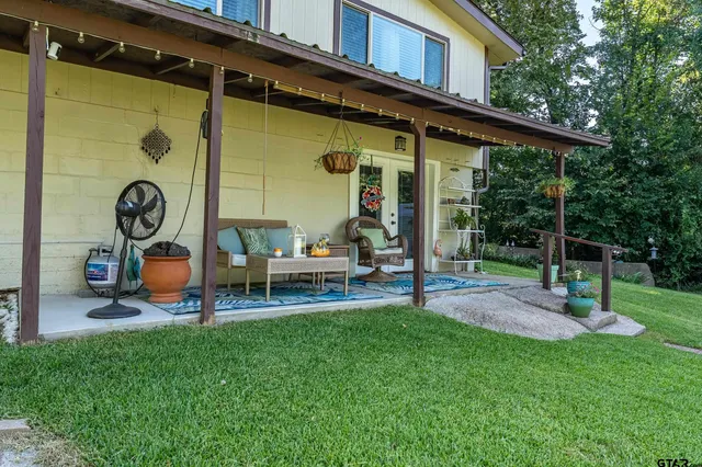 a backyard of a house with seating space