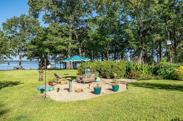 a view of a balcony with wooden floor and seating space