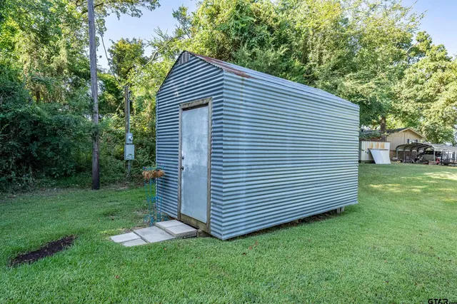 a view of a lake with a house in the background