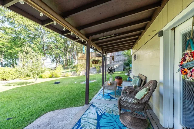 a backyard of a house with outdoor seating