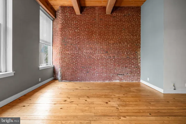 a view of balcony with wooden floor