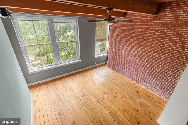a view of a deck with table and chairs with wooden floor and plants