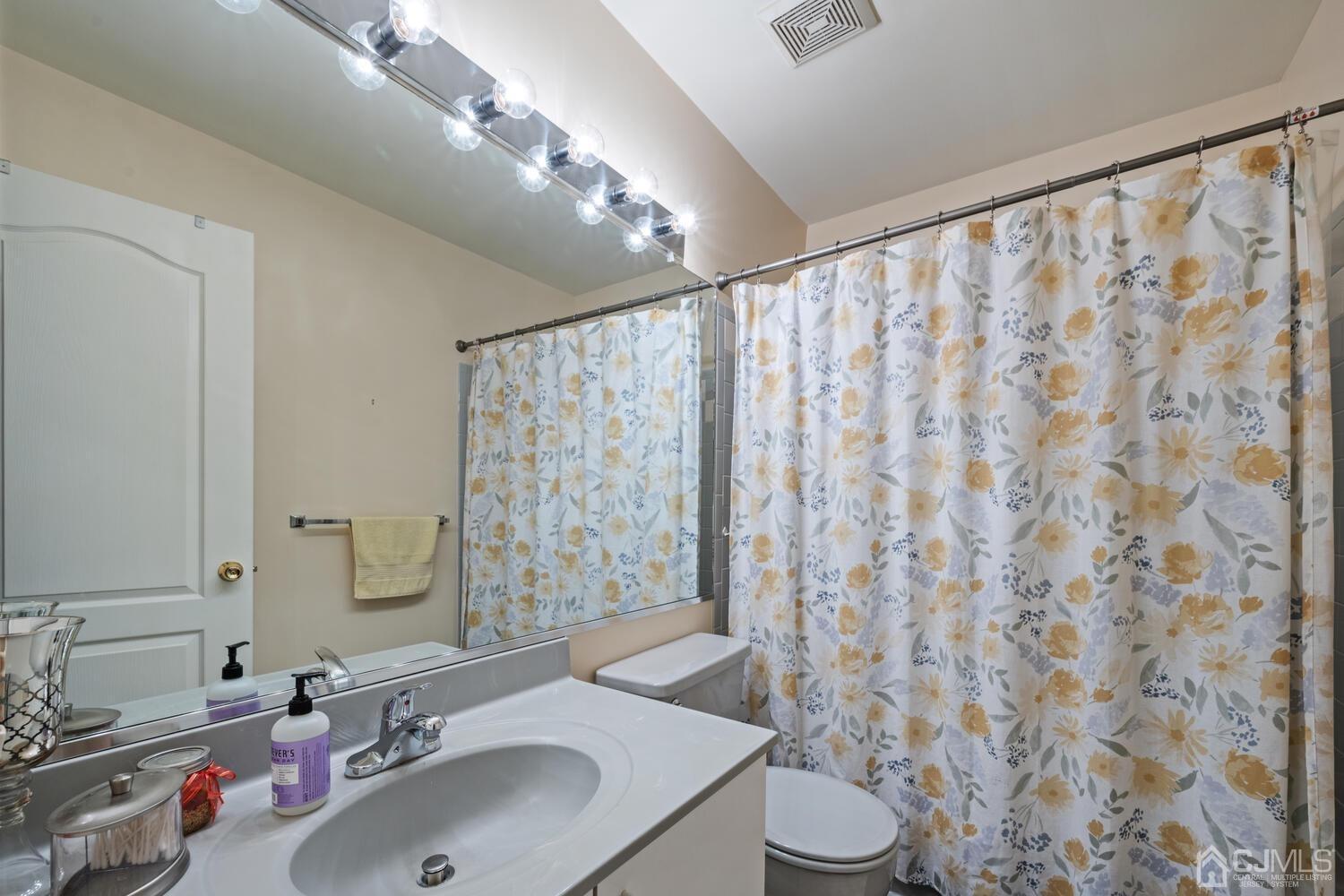 53 Primrose Circle Princeton, NJ 08540 - Photo 26 of 30 a bathroom with a sink and a mirror