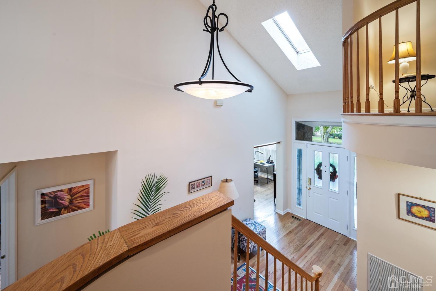 53 Primrose Circle Princeton, NJ 08540 - Photo 4 of 30 a view of a livingroom with furniture wooden floor and a chandelier