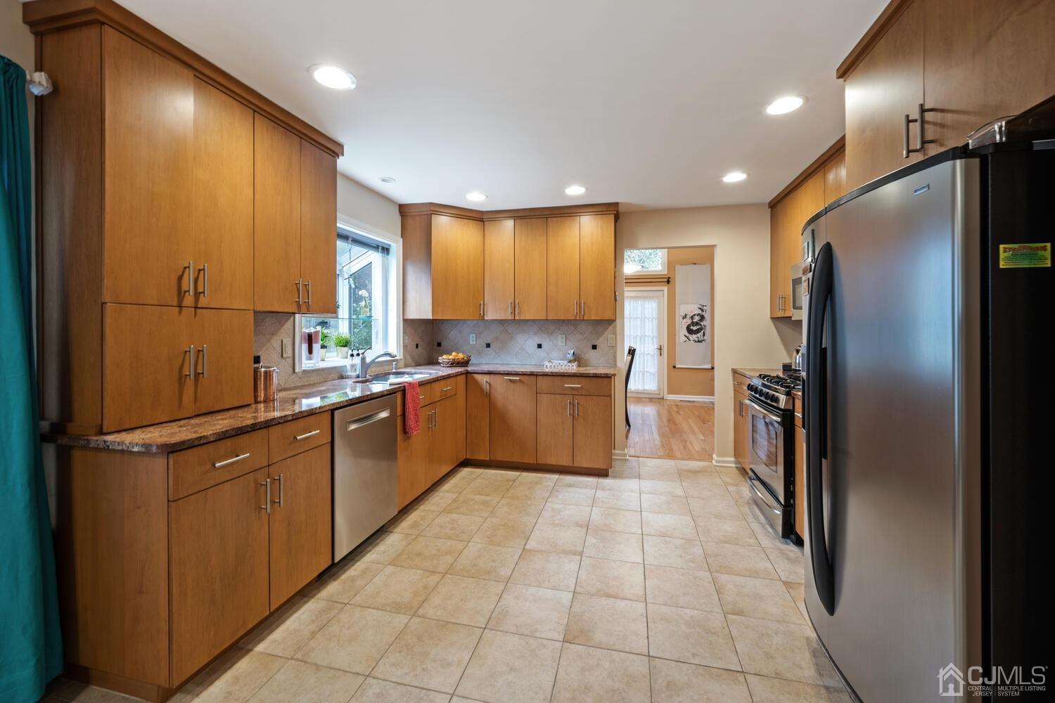 53 Primrose Circle Princeton, NJ 08540 - Photo 6 of 30 a kitchen with stainless steel appliances granite countertop a refrigerator and a sink