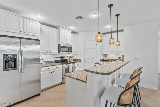 $395,599 | 23440 Alamanda Drive, Unit 103, Estero, FL 34135