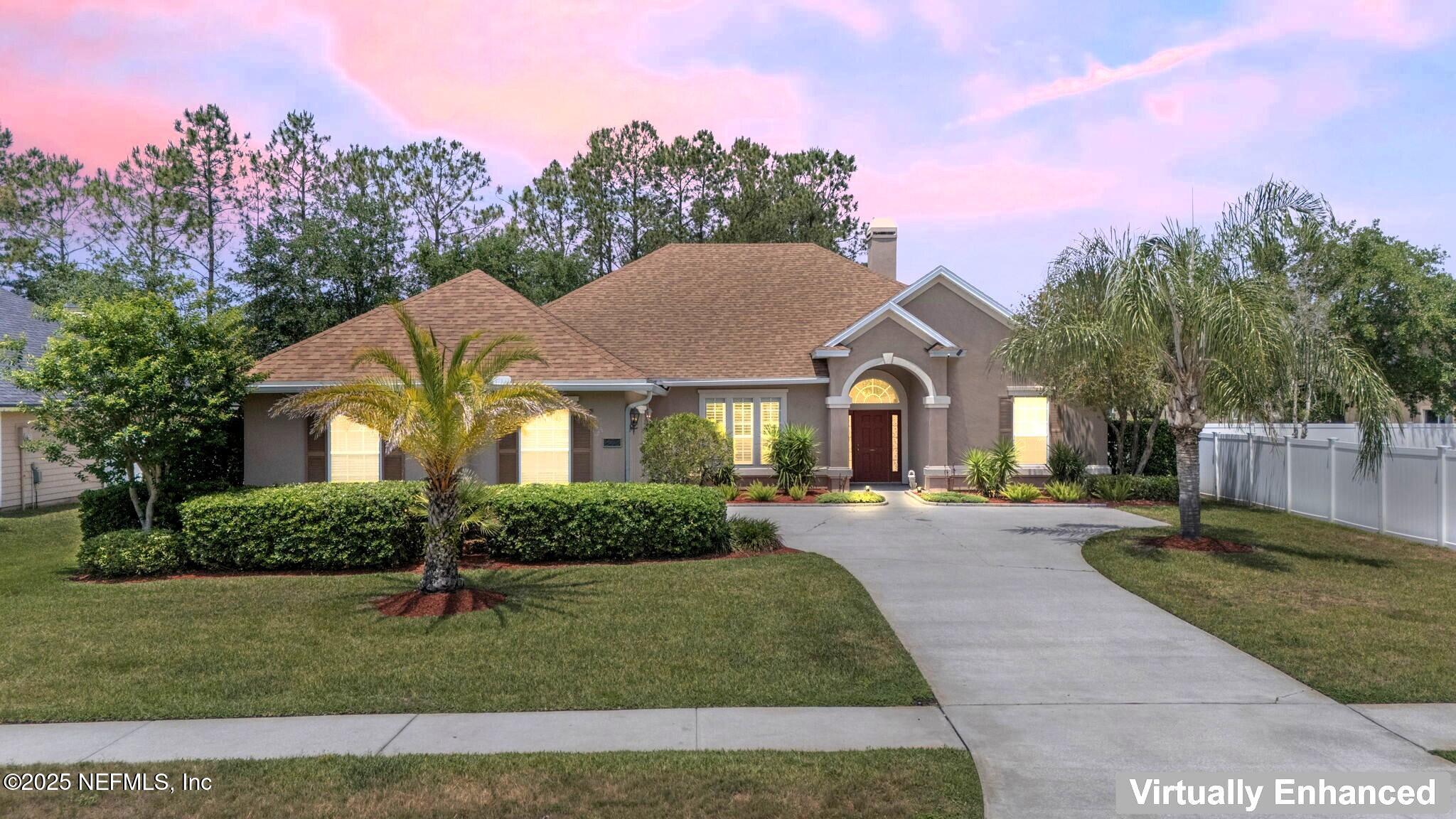232 Porta Rosa Circle St. Augustine, FL 32092 - Photo 2 of 42 a front view of a house with a yard