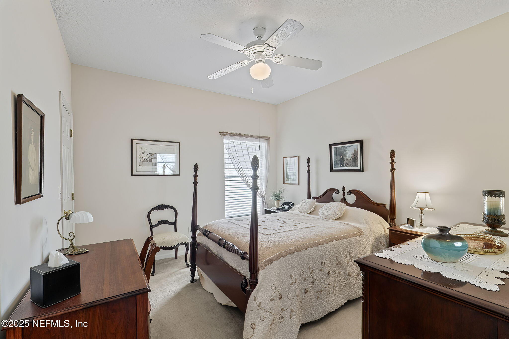 232 Porta Rosa Circle St. Augustine, FL 32092 - Photo 21 of 42 a bedroom with a bed and a table
