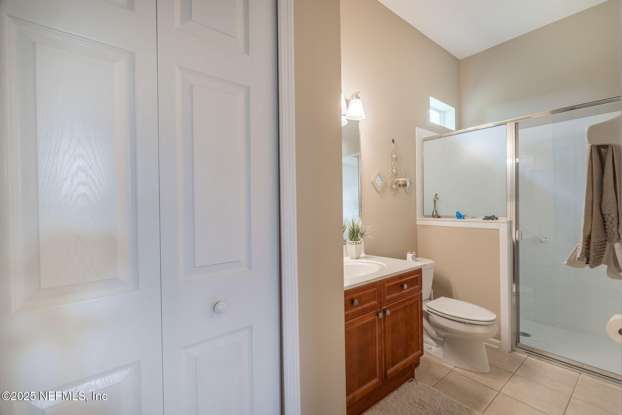 232 Porta Rosa Circle St. Augustine, FL 32092 - Photo 23 of 42 a bathroom with a granite countertop sink toilet and shower