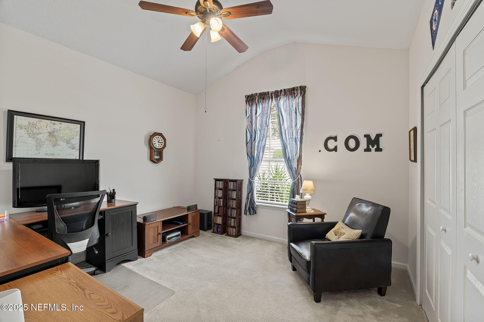 232 Porta Rosa Circle St. Augustine, FL 32092 - Photo 24 of 42 a living room with furniture and a flat screen tv