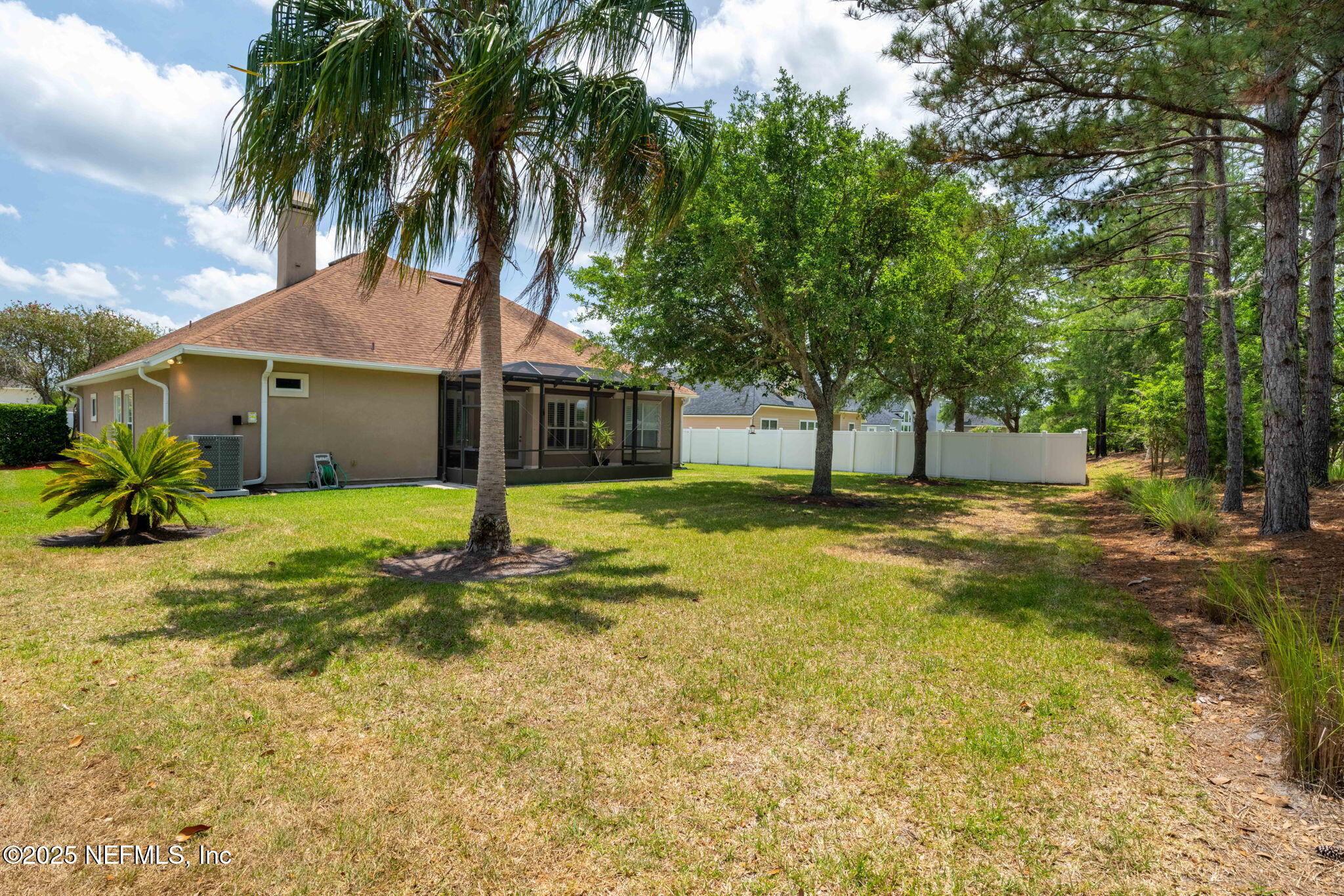 232 Porta Rosa Circle St. Augustine, FL 32092 - Photo 30 of 42 a view of a house with swimming pool and a tree
