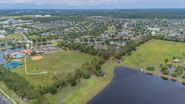 an aerial view of a house with a ocean view