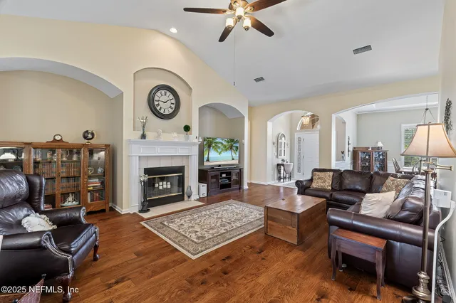 a living room with furniture and a fireplace