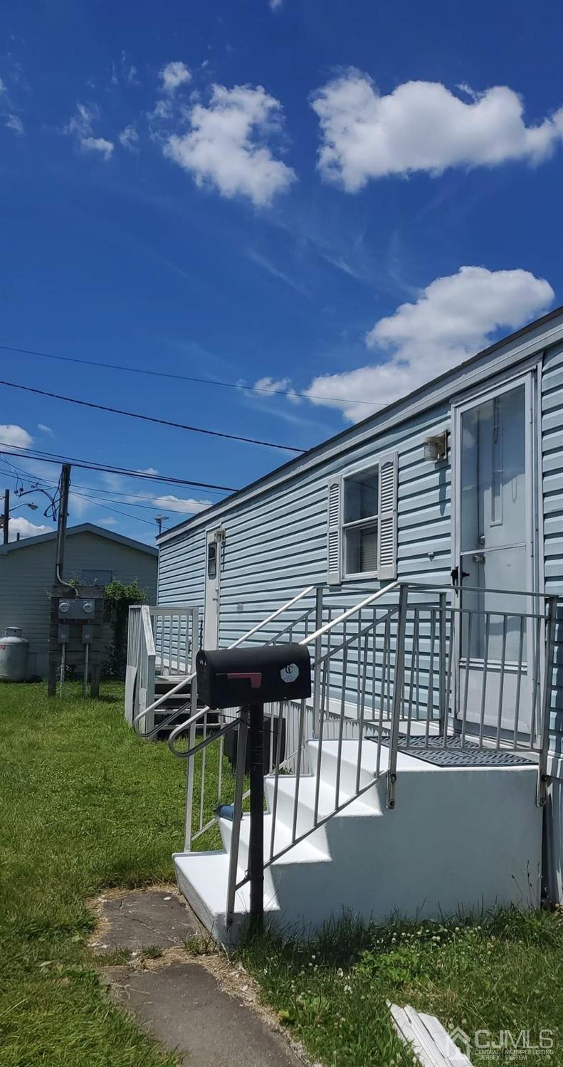 26 Dalbert Street, Unit J4 Carteret, NJ 07008 - Photo 1 of 10 a view of a porch with a table and a chairs