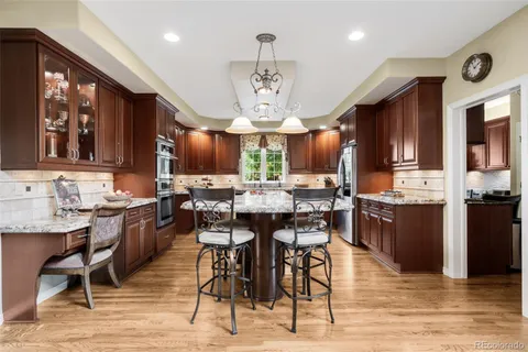 a kitchen with a sink stove and refrigerator
