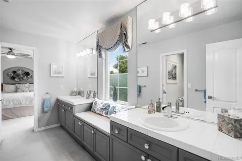 a view of a swimming pool and lounge chairs in the patio