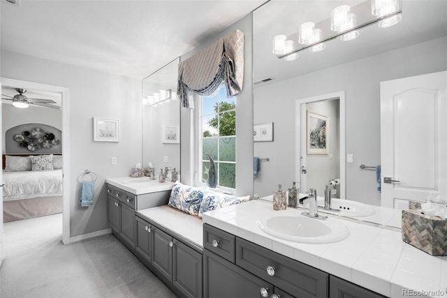 a view of a swimming pool and lounge chairs in the patio