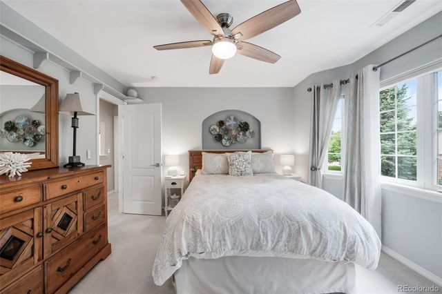 a view of a patio with table and chairs potted plants with sky view