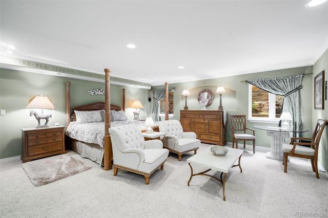 a front view of a house with porch and garden