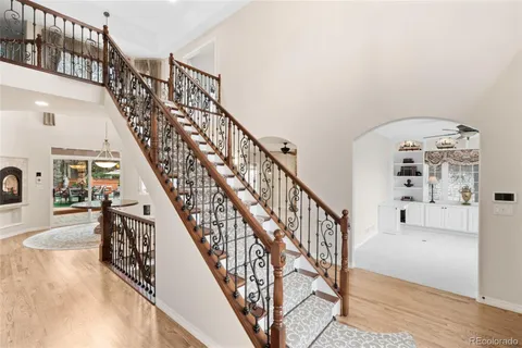 a view of entryway and hall with wooden floor