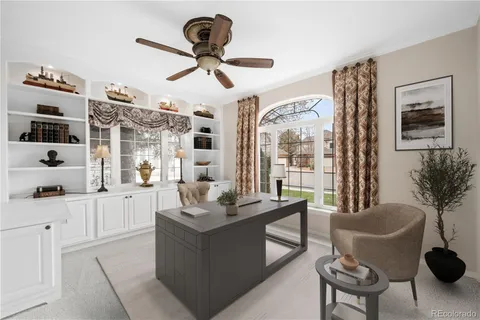 a living room with furniture a flat screen tv and a large window