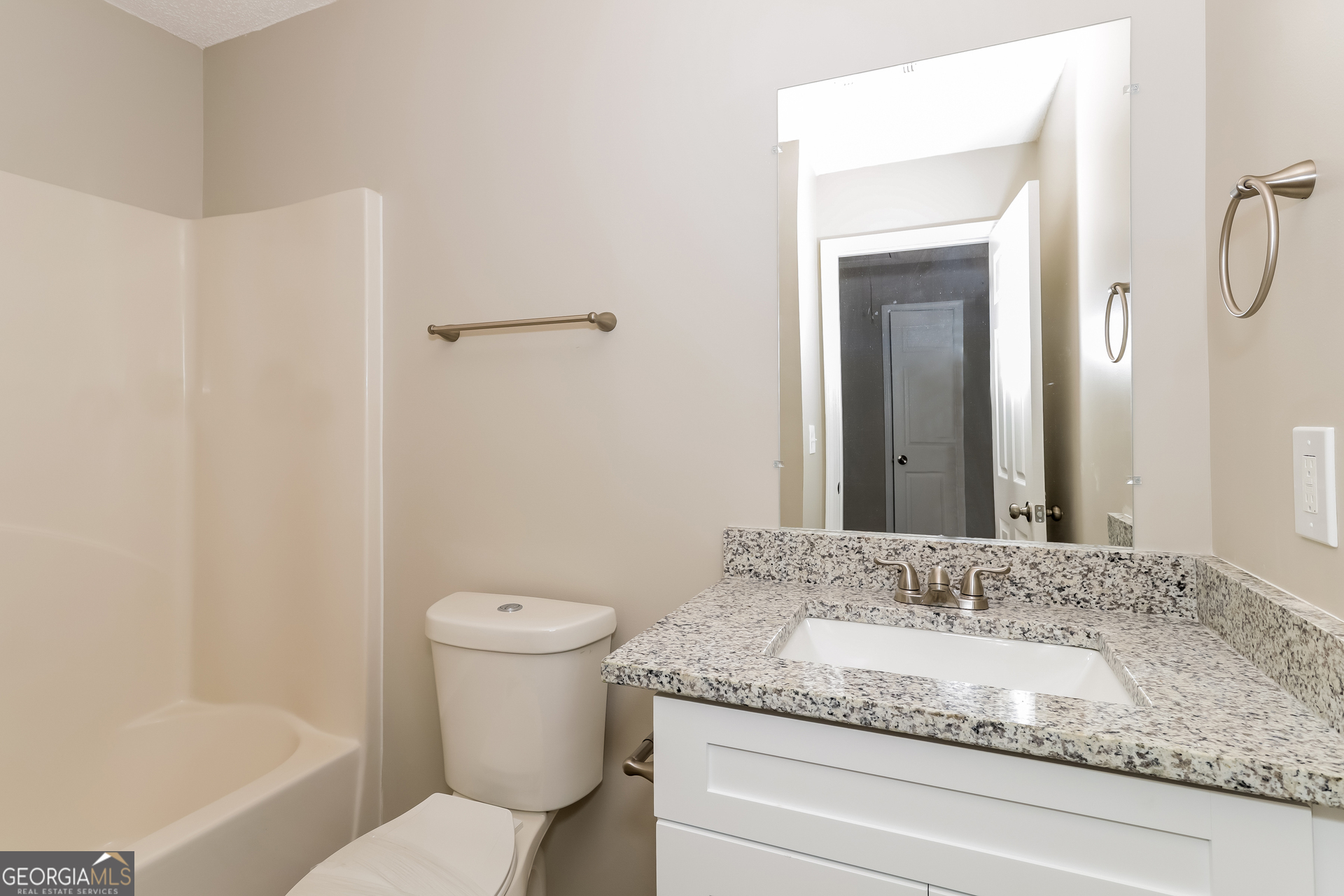 5319 Creekview Way Morrow, GA 30260 - Photo 13 of 17 a bathroom with a granite countertop sink and a mirror