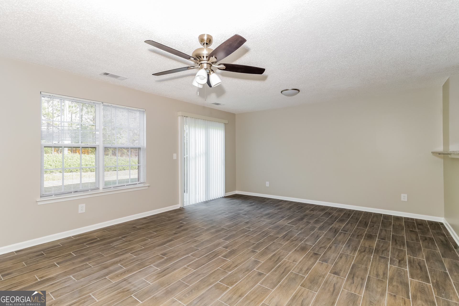 5319 Creekview Way Morrow, GA 30260 - Photo 3 of 17 a view of an empty room with wooden floor and window