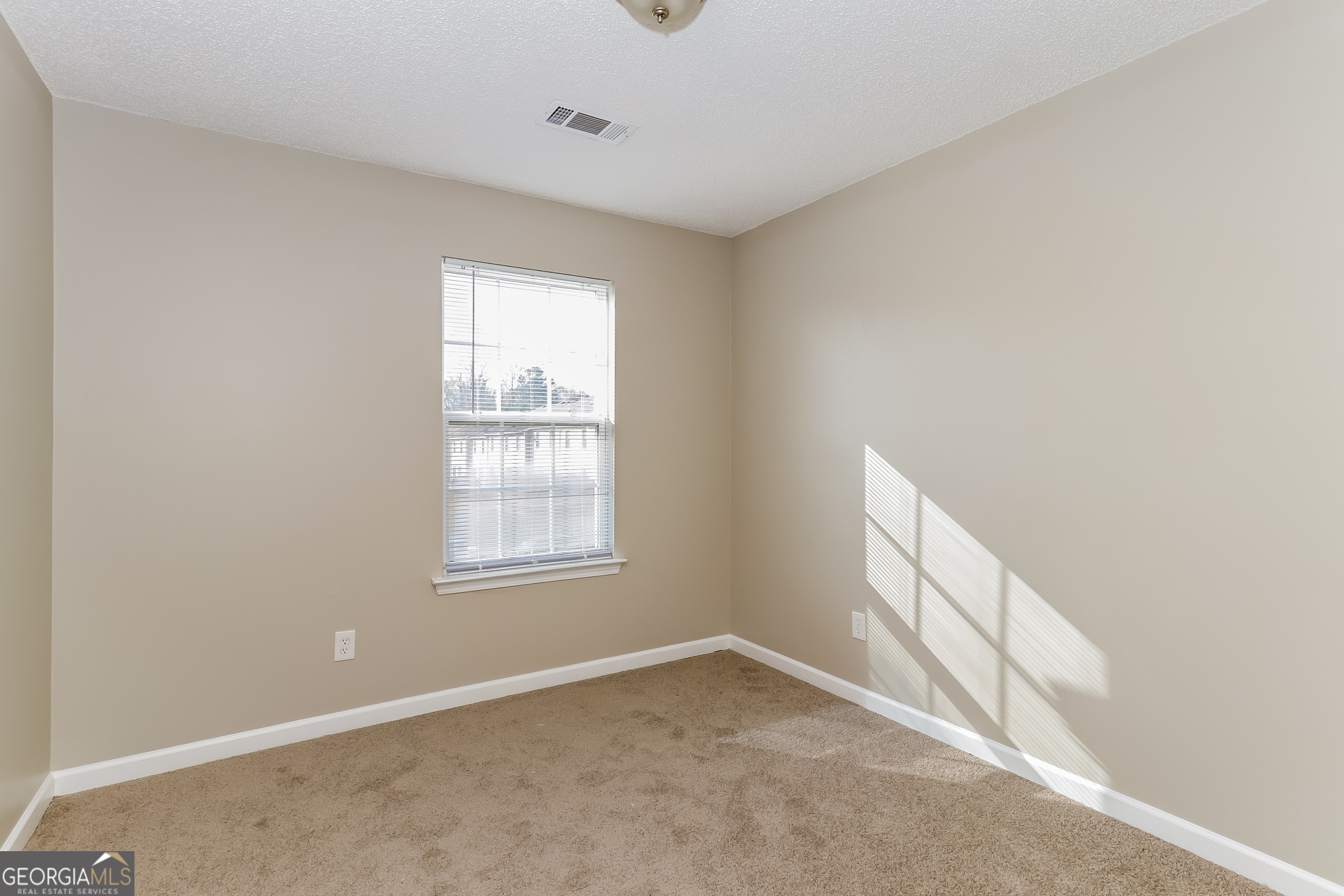 5319 Creekview Way Morrow, GA 30260 - Photo 10 of 17 a view of an empty room and window