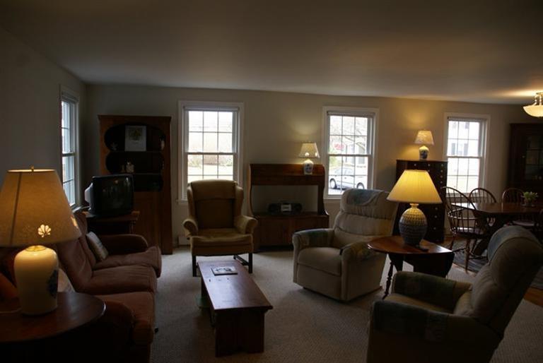 95 Depot Road, Unit 14 Chatham, MA 02633 - Photo 5 of 11 a living room with furniture fireplace and a window