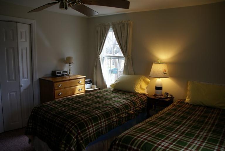 95 Depot Road, Unit 14 Chatham, MA 02633 - Photo 8 of 11 a bedroom with a bed and a window