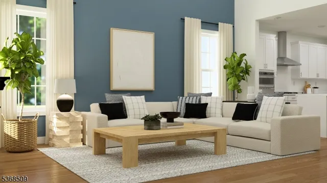 a living room with furniture and a potted plant