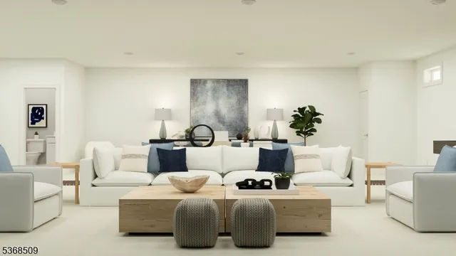 a living room with furniture and a potted plant