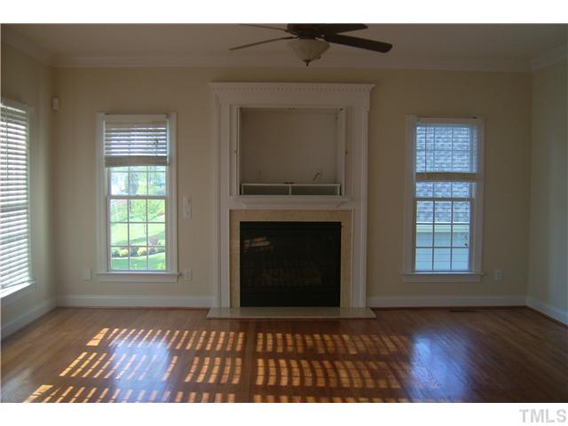 527 Competition Road Raleigh, NC 27603 - Photo 3 of 7 a view of an empty room with wooden floor and a window
