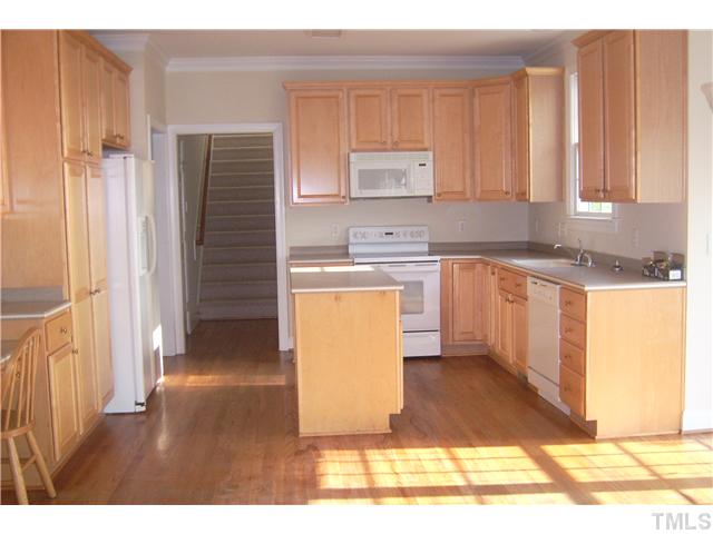 527 Competition Road Raleigh, NC 27603 - Photo 5 of 7 a kitchen with a sink cabinets and appliances