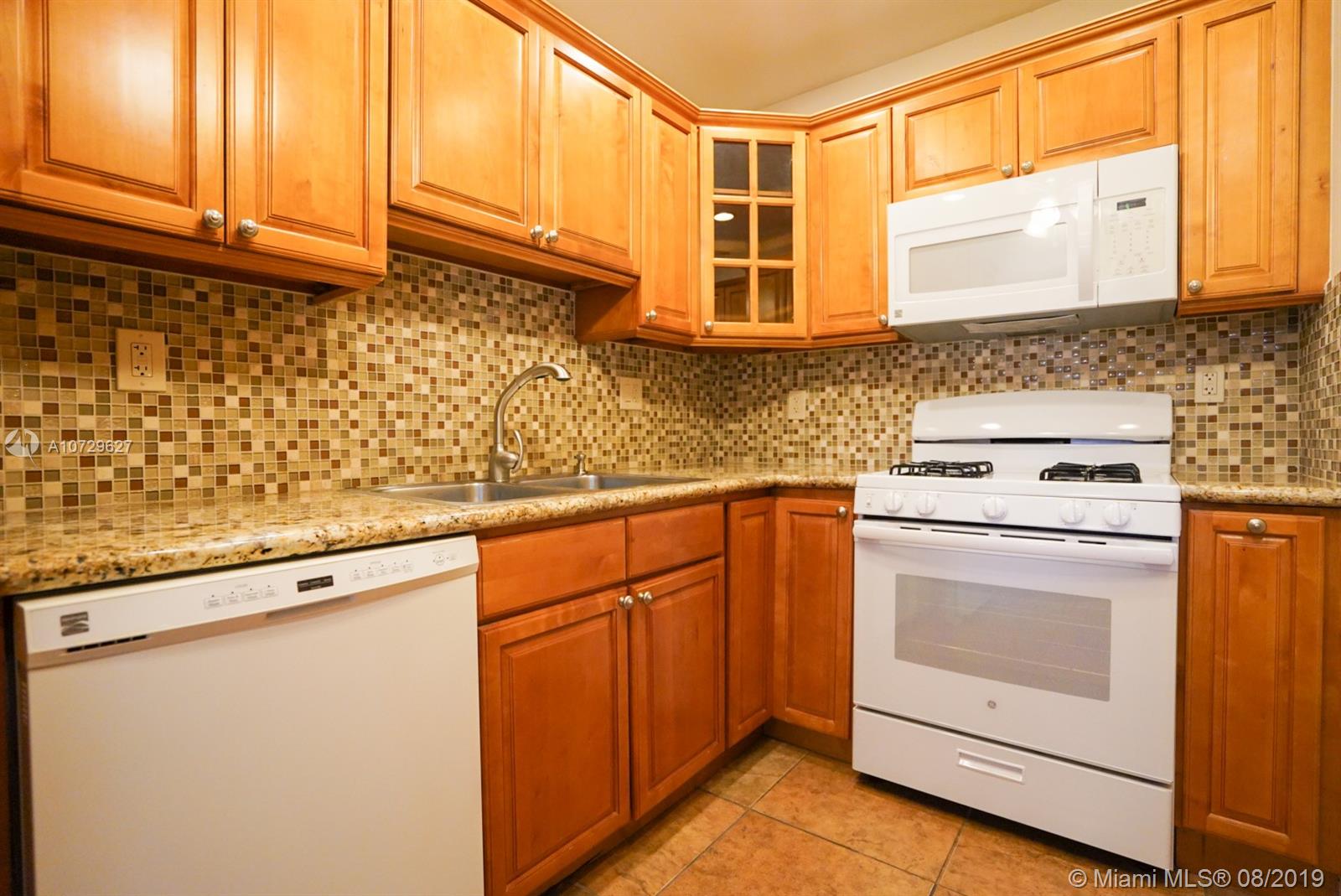 11501 Southwest 109th Road, Unit 13D Miami, FL 33176 - Photo 19 of 30 Kitchen Appliances - Dishwasher, Gas Stove, Microwave, uniformed White