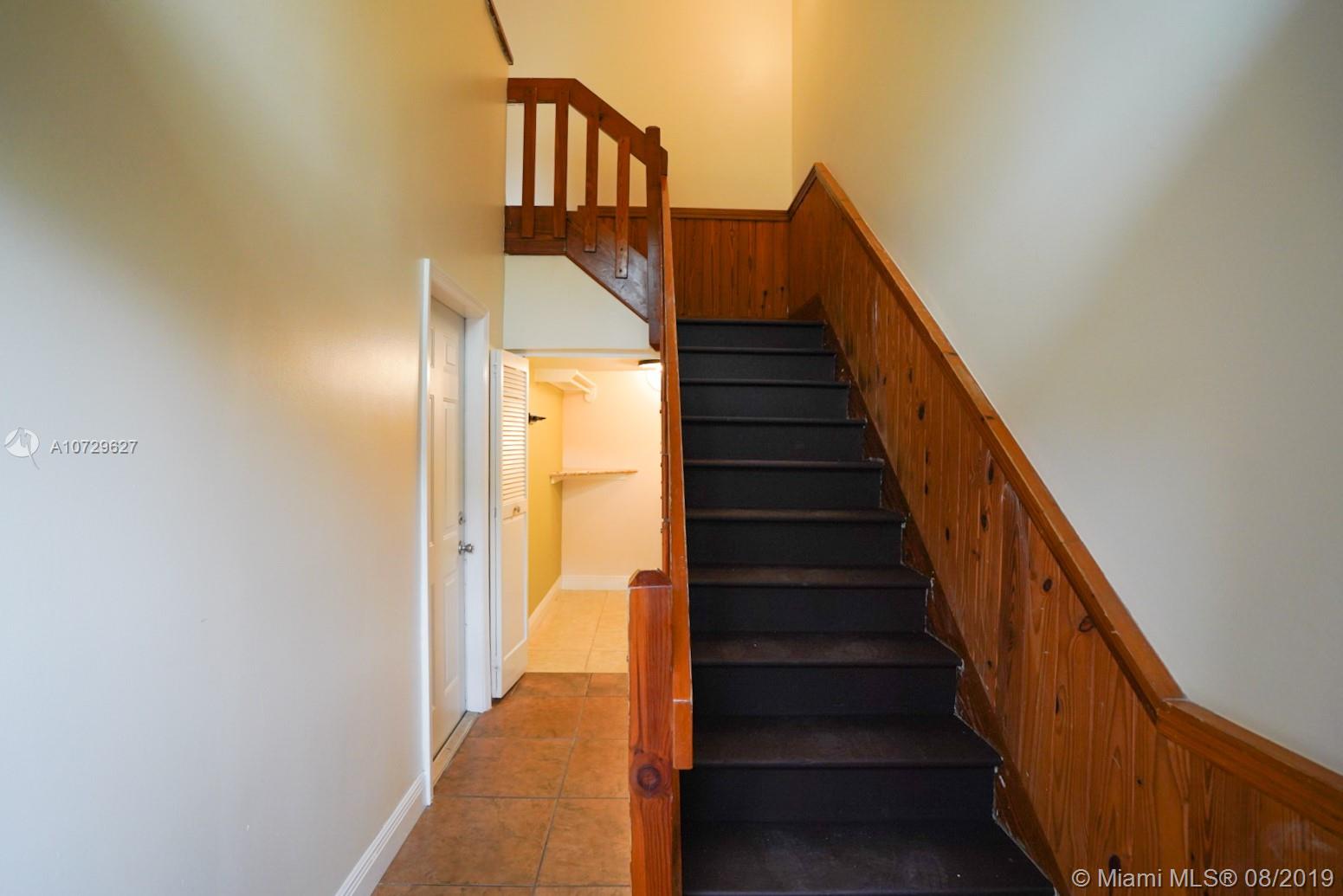 11501 Southwest 109th Road, Unit 13D Miami, FL 33176 - Photo 23 of 30 Foyer - Laundry Room Entrance