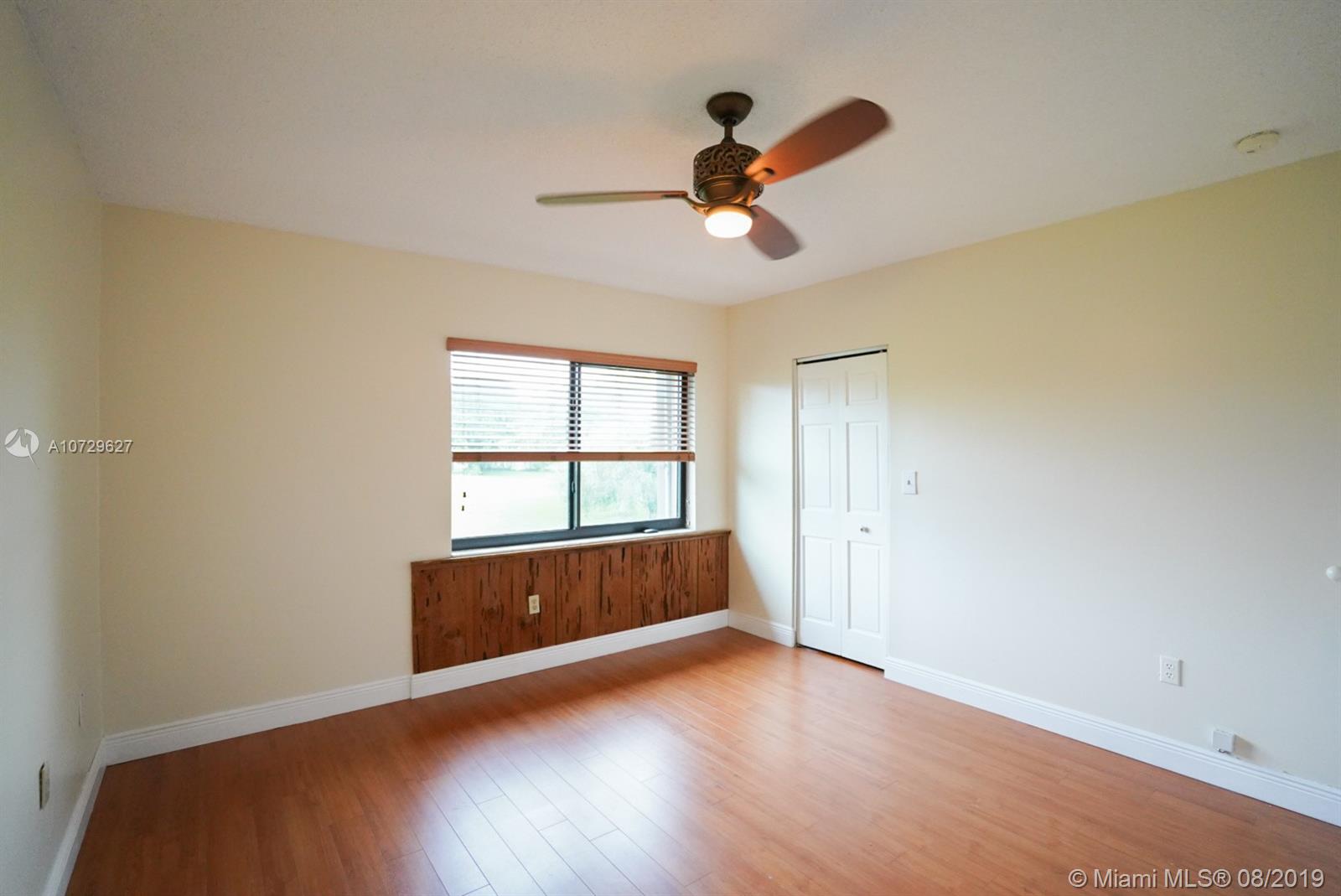 11501 Southwest 109th Road, Unit 13D Miami, FL 33176 - Photo 6 of 30 Master Bedroom with Garden View Window