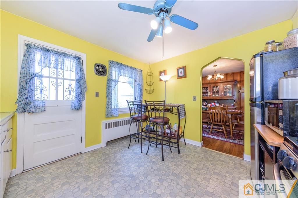 138 River Edge Road Bergenfield, NJ 07621 - Photo 11 of 28 a view of a livingroom with furniture and a ceiling fan