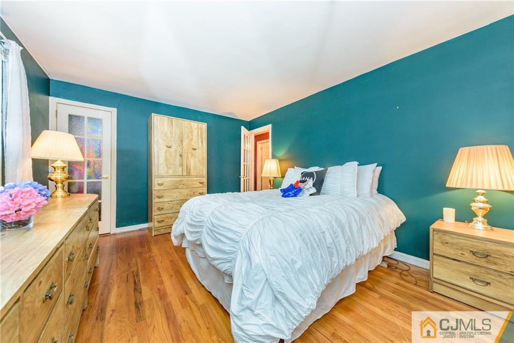 138 River Edge Road Bergenfield, NJ 07621 - Photo 14 of 28 a bedroom with a bed and a closet