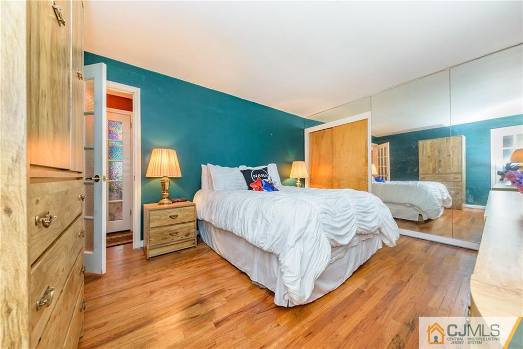 138 River Edge Road Bergenfield, NJ 07621 - Photo 15 of 28 a bed room with a bed and a dresser